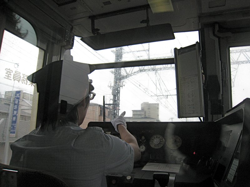 Train driver pointing